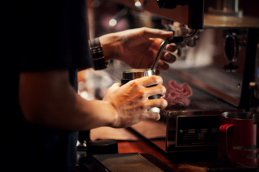 A barista making coffee