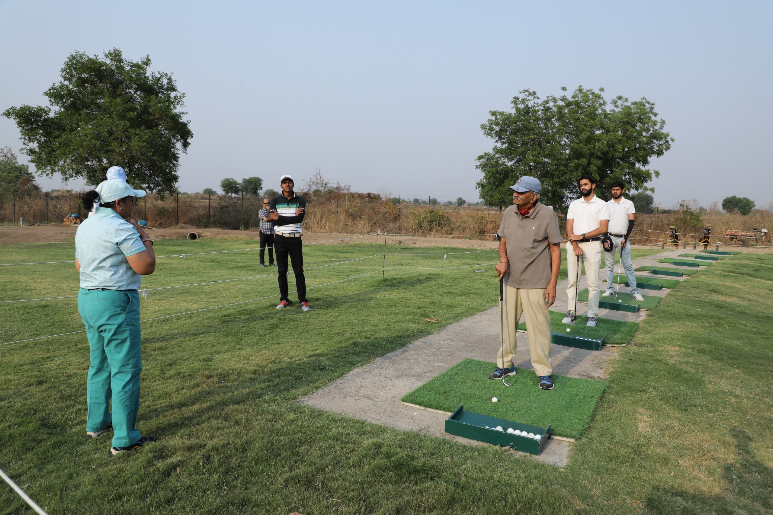 Golf coaching session in progress