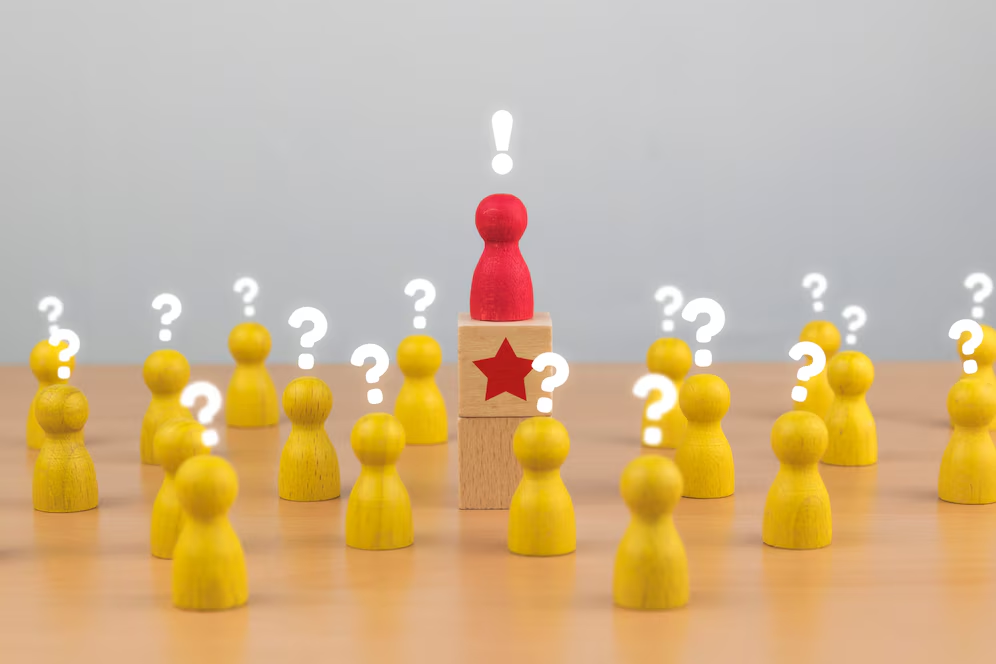 Abstract image of game pawns with question marks